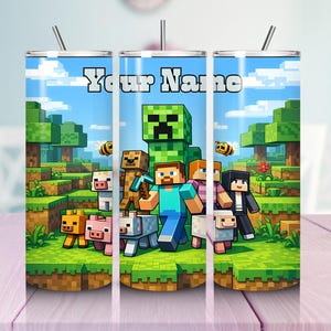 May include: A set of three stainless steel tumblers with a Minecraft-themed design. Each tumbler features a different scene with characters and the text "Your Name" in a bold font. The background includes a blue sky and green landscape.