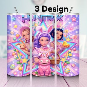 May include: Three colorful Easter-themed tumblers with a cartoon design. Each tumbler features a different girl with bunny ears, holding Easter eggs, a bunny, and a chick. The tumblers have a pink, purple, and blue color scheme.