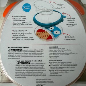 May include: A baby feeding set with a divided plate, translucent bowl, and removable training rim. The plate features a non-skid bottom and is microwave and dishwasher safe. The set is BPA, PVC, and phthalate-free.