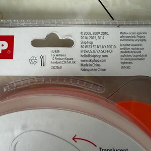 May include: A close-up of a translucent bowl with an orange rim. The packaging includes the text "Translucent bowl" and "Bol translucide". The product meets safety standards and is made in China.