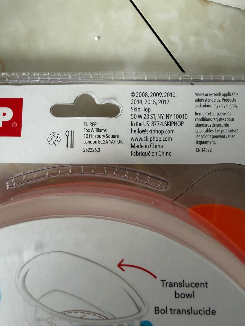 May include: A close-up of a translucent bowl with an orange rim. The packaging includes the text "Translucent bowl" and "Bol translucide". The product meets safety standards and is made in China.