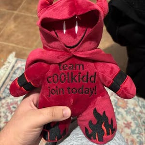 Red Hacker Mascot Plush – Team c00lkidd Stuffed Toy, Hooded Villain Figure (25cm)