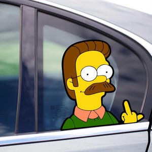 May include: A car window sticker depicting a cartoon character with yellow skin, brown hair, a moustache, and glasses. The character is giving the middle finger. The sticker is on a car window.