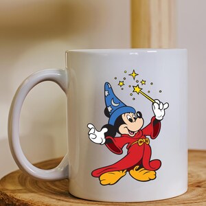 May include: A trio of cream-glazed ceramic mugs, each adorned with a hand-painted design. One features a blue and green leaf, another a yellow flower, and the last a red berry. The mugs have a rounded form.