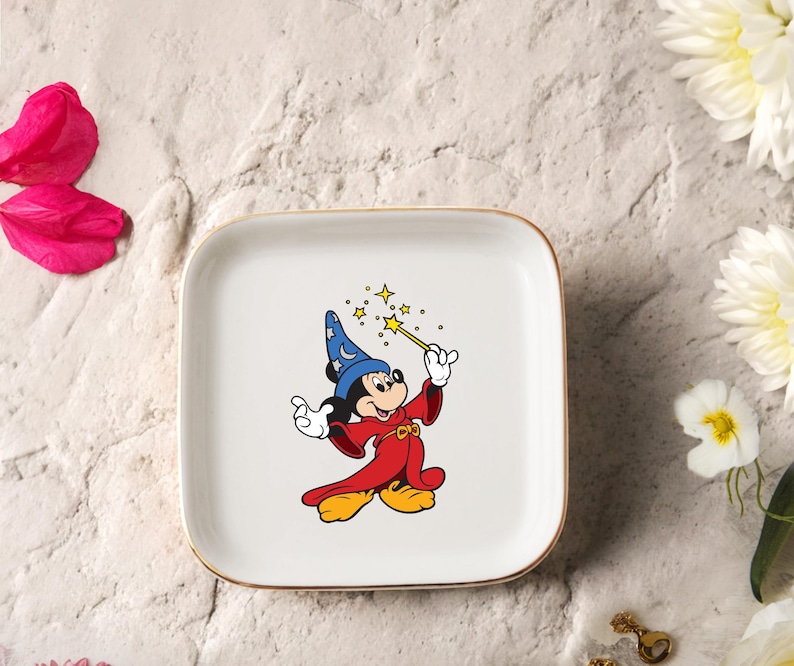 May include: A rustic wooden sign with the text "Welcome" in a handwritten style. The sign is painted white with a distressed finish, and features a decorative floral element. The background is a blurred image of a home.