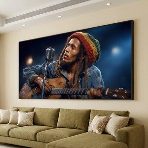 May include: A framed canvas print depicting a musician playing a guitar and singing into a microphone. The musician wears a denim jacket and a red, yellow, and green hat. The print is displayed above a green sectional sofa with decorative cushions.