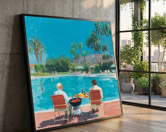 May include: A framed rectangular wall art print depicting two individuals sitting in red chairs by a turquoise swimming pool. The scene features palm trees, a small charcoal grill, and a table with food and drinks under a bright blue sky.
