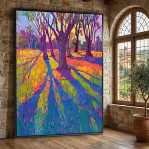 May include: A large, framed landscape painting with vibrant colours. The artwork depicts trees casting long shadows across a field, with hues of purple, blue, yellow, and orange. The painting is displayed in a room with a brick wall and a window.