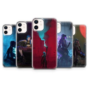 May include: Five clear phone cases, each displaying a different illustration of a character with blue hair and dark clothing. The cases feature vivid artwork with red, blue, and purple tones, creating a dynamic visual appeal.