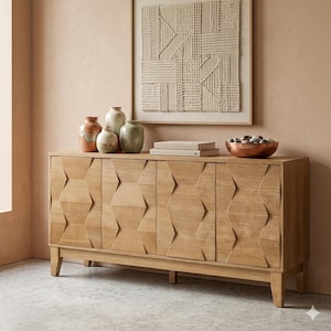 May include: A light-colored wooden cabinet with four doors, featuring a geometric design. The cabinet is topped with decorative vases, books, and a copper bowl. A woven wall hanging is above the cabinet.