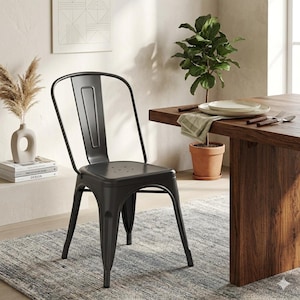 May include: A black metal dining chair with a curved back and a slatted seat. The chair has four legs and is positioned in front of a wooden table. The chair is approximately 34 inches tall.