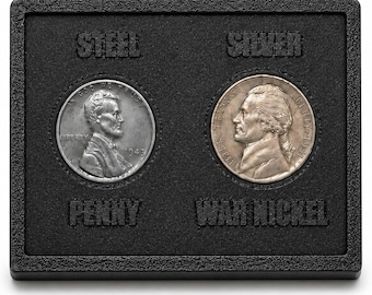 May include: A black display case holding a 1943 steel penny and a war nickel. The case has the words "STEEL", "SILVER", "PENNY", and "WAR NICKEL" embossed on it. The coins are silver and gray.