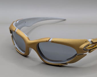 Oakley Plate 1.0 Goud & Wit – Y2K Sportzonnebril met zilverkleurige lenzen