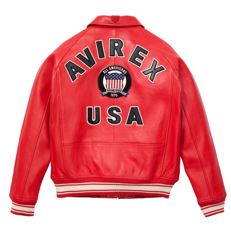May include: A red leather jacket with the word "AVIREX" arched across the shoulders in white lettering. Below the word "AVIREX" is a circular patch with the American flag and the words "ALL AMERICANS ESTABLISHED 1975". The word "USA" is printed below the patch.