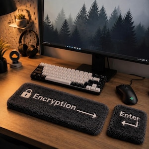 May include: A computer setup featuring a black and white mechanical keyboard, a black mouse, and a dark gray Encryption and Enter keypads. The Encryption keypad has a lock icon and the word "Encryption" with an arrow. The Enter keypad has the word "Enter" with an arrow.