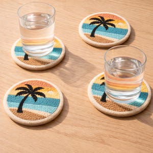 May include: Four round coasters with a beach scene design. Each coaster features a black palm tree, blue ocean, and a sunset in shades of orange and yellow. The coasters are made of a textured material and are beige around the edges.