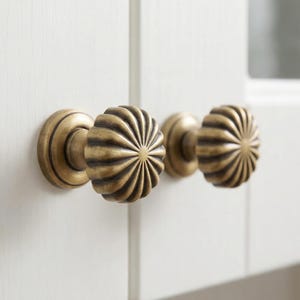 May include: A rustic wooden sign with the text "Welcome to our home" in white lettering. The sign features a distressed finish and a simple, inviting design, perfect for front door decor.