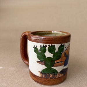 May include: A rustic wooden sign with the text "Welcome to our home" in white lettering. The sign features a distressed finish and a simple, inviting design, perfect for front door decor.