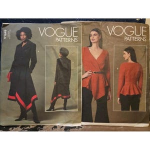 May include: Two vintage Vogue Patterns featuring women's fashion designs. One pattern shows a black coat with red trim and a matching skirt. The other pattern features a wrap top and a peplum top.