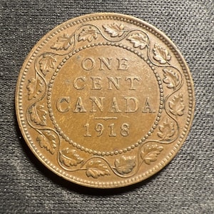 Canadian 1918 cent  fine condition plus 2 mystery coins
