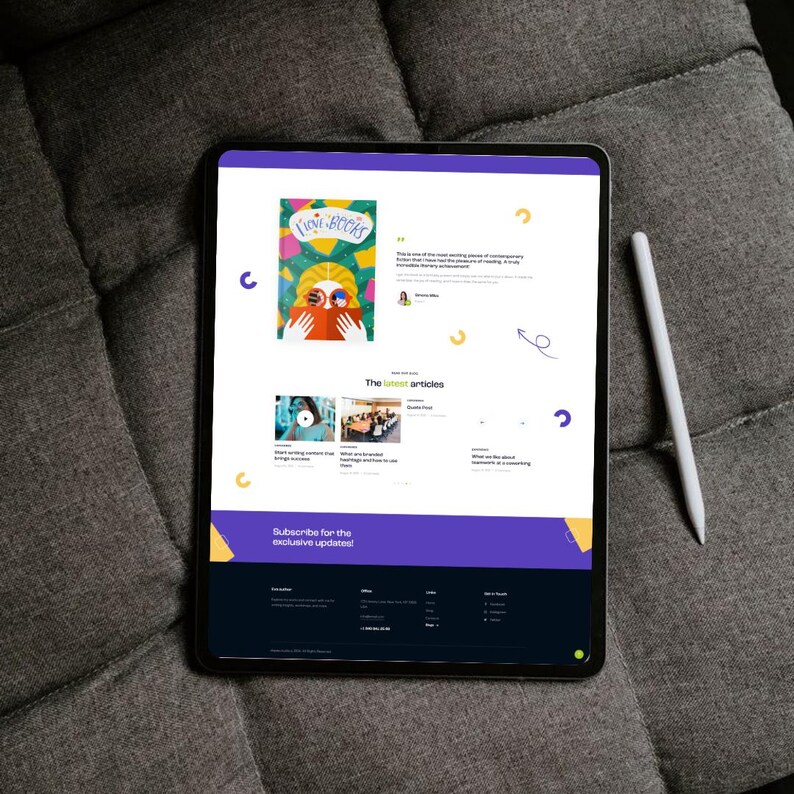 May include: A black tablet displaying a website with a colorful illustration of a person reading a book. A white stylus rests on the right. The website features articles and a subscription call to action.