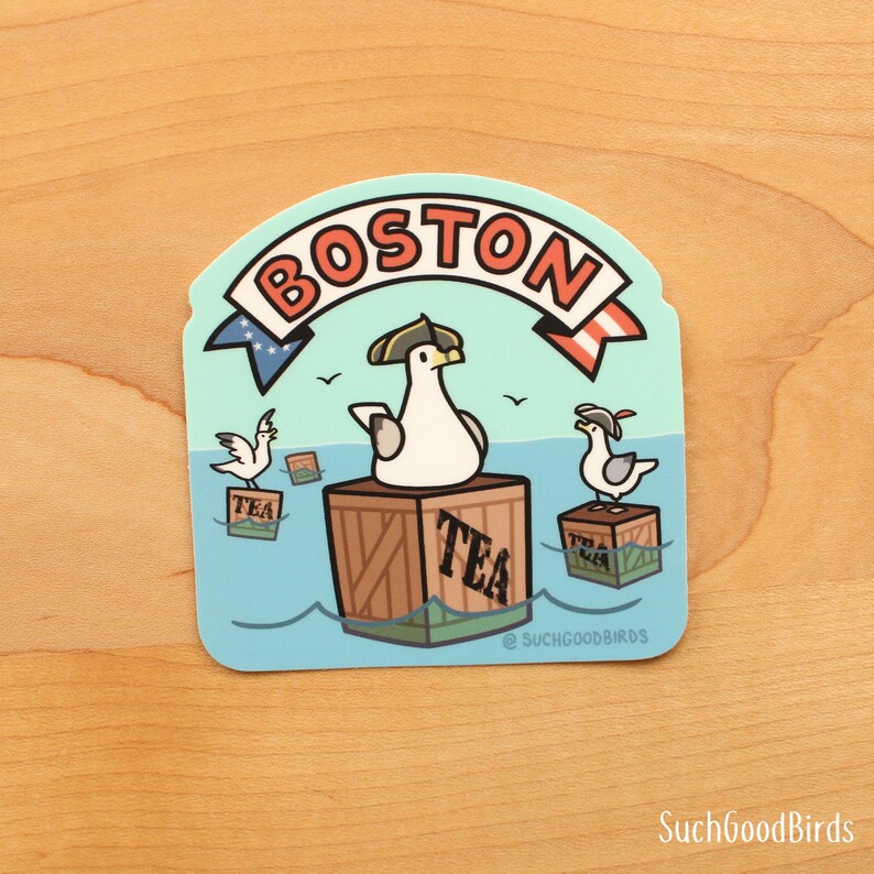 May include: A blue and white sticker with a cartoon seagull wearing a captain's hat and holding a tea box. The seagull is standing on a wooden crate with the word "TEA" printed on it. The sticker also features the word "BOSTON" in a red and white banner.