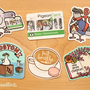 May include: A set of ten colorful stickers featuring illustrations of pigeons and other birds. The stickers include phrases like "Boston", "Just Breathe", and "One More Chapter".