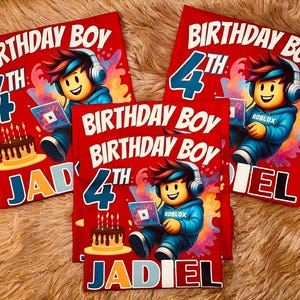 May include: Red t-shirts with a colorful graphic design for a 4th birthday. The design includes the text "BIRTHDAY BOY", the number "4", a cartoon character wearing headphones and holding a laptop with the Roblox logo, a chocolate cake with candles, and a name.