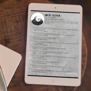 May include: A white tablet displaying a character sheet for "Uncle Fester" with a cartoon image. The sheet includes vocal range, character type, and a list of musical details. The tablet is on a wooden surface.