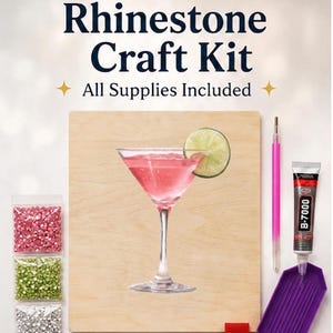 May include: Rhinestone Craft Kit with all supplies included. The kit features a wooden board with a pink cocktail and lime wedge design. Includes rhinestones in pink, green, and silver, a pink stylus, glue, and a purple tray.