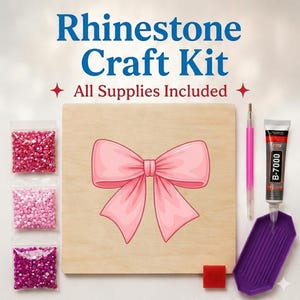 May include: A rhinestone craft kit featuring a square wooden board with a pink bow illustration, three bags of pink rhinestones, a pink applicator tool, a tube of B-7000 glue, a purple tray, and a red wax square. Text reads Rhinestone Craft Kit.