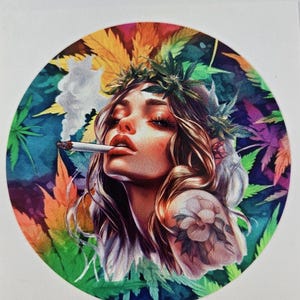 May include: Circular illustration of a woman with long brown hair, a cannabis leaf crown, and a tattoo. She is smoking a cigarette. The background features colorful cannabis leaves in shades of green, orange, and purple.