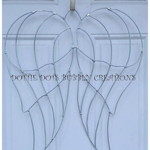 May include: Silver wire angel wings, a DIY craft project, with the text "Dottie Dots Bubbly Creations" on the bottom.