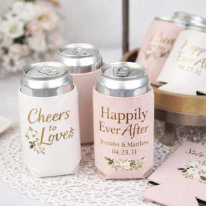 Elegant wedding can coolers personalized with names and wedding date. Soft blush and ivory designs create a romantic reception detail guests love. Perfect for wedding favors, bridal showers, and engagement parties. Insulated foam keeps drinks cold and hands dry during celebrations. Made to order with crisp printing and premium material. Ideal for classic, garden, and modern weddings where thoughtful details make lasting memories. Guests appreciate stylish favors that elevate every toast. Always!