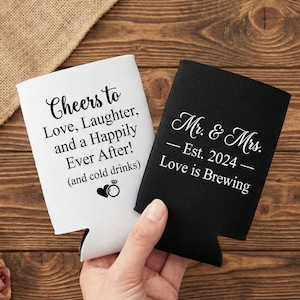 Wedding can coolers featuring playful and elegant text designs for celebration-ready favors. Personalized foam sleeves showcase wedding sayings, names, and dates guests will love using again. Designed to hold beer or soda cans comfortably while keeping drinks cold during receptions. Ideal for engagement parties, weddings, and after-parties. Popular as bulk favors and bar accessories. Made to order with smooth foam material, crisp lettering, and long lasting print durability.