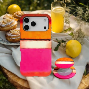 May include: A rectangular phone case and a matching circular phone grip featuring a horizontal colour-blocked design. The pattern consists of a deep orange top section, a thin black line, a white middle stripe, and a vibrant pink bottom section.