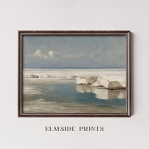 May include: A framed landscape print featuring a serene coastal scene. The artwork depicts a tranquil body of water reflecting the sky and ice formations. The color palette includes shades of blue, white, and brown. The text "ELMSIDE PRINTS" is at the bottom.
