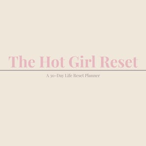 May include: A planner with the title "The Hot Girl Reset" in pink lettering. Below the title is the text "A 30-Day Life Reset Planner." The bottom of the planner has the text "Same woman. Upgraded life."