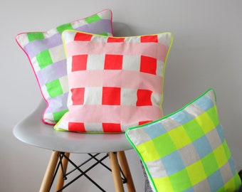 Neon check screen printed cushion