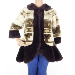 May include: A vintage coat with a geometric pattern in shades of brown, beige, and cream. The coat features a dark brown collar, cuffs, and trim. The coat has a flared bottom and three-quarter length sleeves.