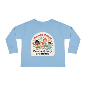 May include: A set of three ceramic nesting bowls in graduating sizes. The bowls are white with a speckled, textured finish and feature a slightly flared rim. Ideal for food prep or serving.