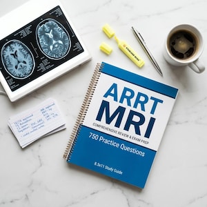 May include: A study setup with a book titled "ARRT MRI Comprehensive Review & Exam Prep" with 750 practice questions. Includes a cup of coffee, a highlighter, pen, and brain scan images. The book is 21.6 x 27.9 cm.