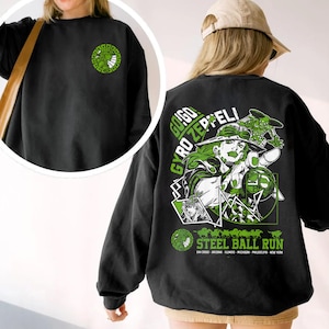 May include: Black sweatshirt with a green and white graphic on the back featuring the text "Gyro Zeppeli Steel Ball Run." The front left chest has a smaller green and white graphic. The sweatshirt is worn by a person.