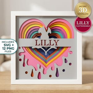 Pode incluir: Uma obra de arte em papel em camadas emoldurada, com um design de coração em cores do arco-íris. O nome "LILLY" é exibido no coração. Inclui arquivos SVG e PNG. Download 3D instantâneo.