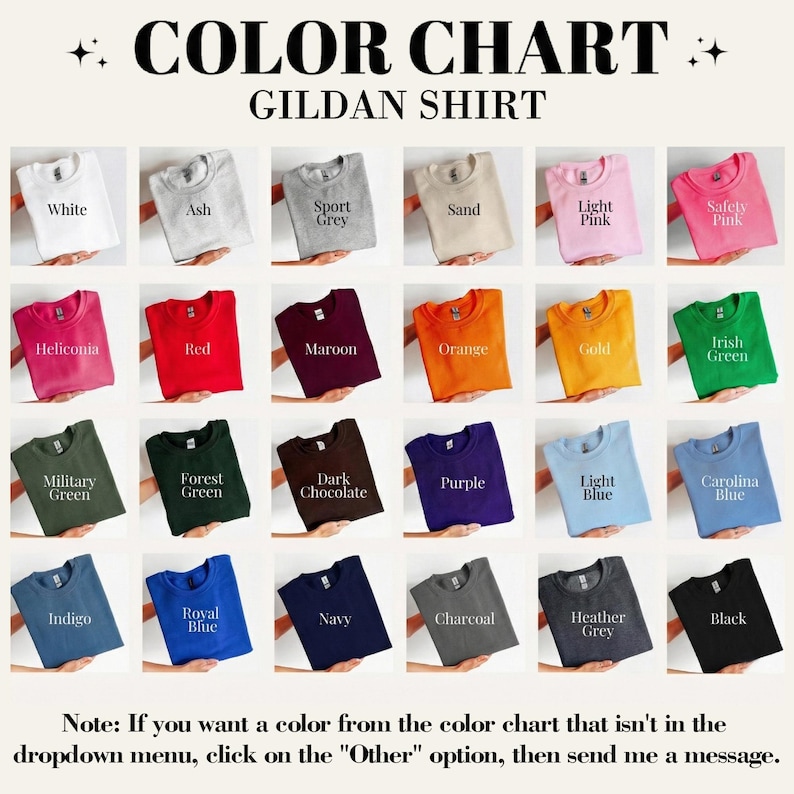May include: A Gildan shirt colour chart displaying a range of hues: white, ash, sport grey, sand, light pink, safety pink, red, maroon, orange, gold, green, blue, and black. The text at the bottom explains how to request a custom colour.