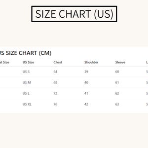 May include: A size chart labeled "SIZE CHART (US)" with measurements in centimeters. The chart includes sizes S, M, L, and XL, with corresponding chest, shoulder, sleeve, and length measurements. The chart is on a cream-colored background.