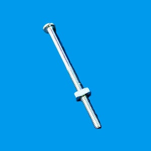 May include: A shiny, silver bolt with a hexagonal nut. The bolt has a threaded shaft and a flat head. The nut is square and fits snugly on the bolt's threads. The background is a solid, bright blue.