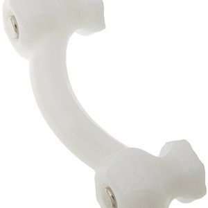 May include: A white, curved cabinet pull with a decorative design. The pull has a curved handle and two ends with a decorative shape. The hardware is silver. This cabinet pull is a decorative element for furniture.