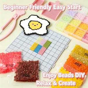 May include: A fuse bead craft kit featuring a white square pegboard, a finished pixel art egg, pink plastic tweezers, two pink sorting trays, and multiple clear bags filled with small colorful plastic beads labeled with codes like F12, F06, and A07.