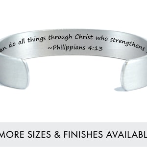 May include: Silver bracelet with the inscription "I can do all things through Christ who strengthens me ~Philippians 4:13".